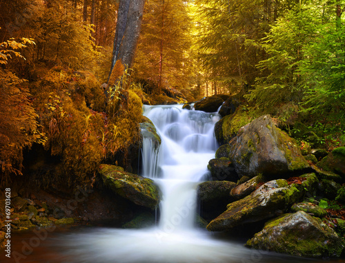 Autumnal landscape with waterfall