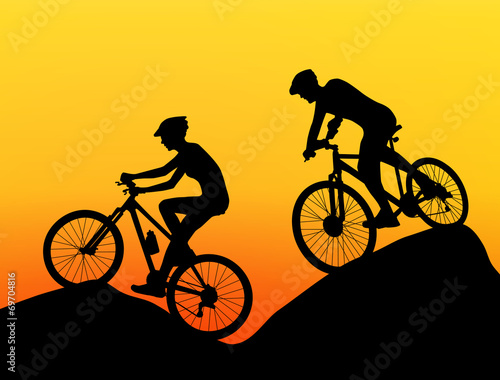 two cyclists silhouette extreme biking