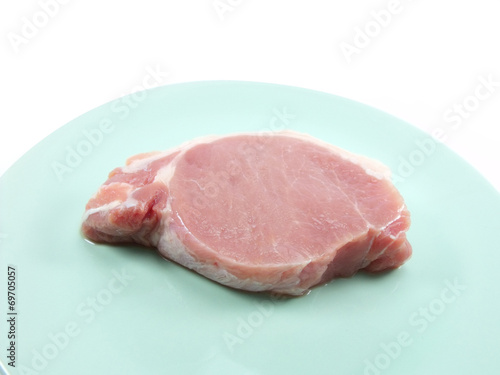 fresh raw meat on green dish background