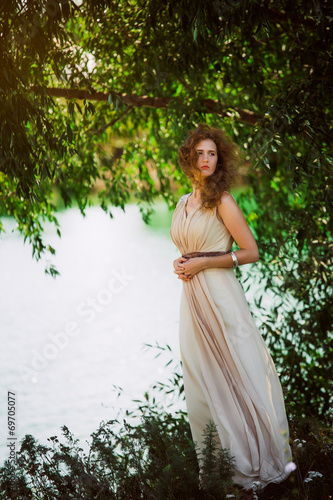 female model in long beige dress posing  © ruslan1117