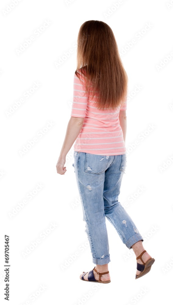 back view of walking woman . back view of walking woman .