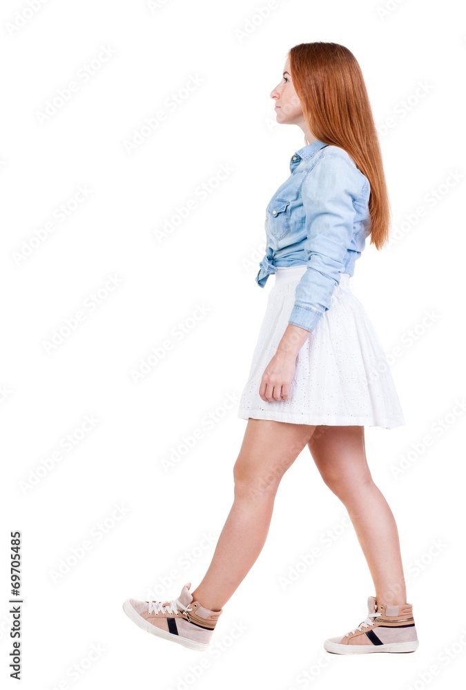 back view of walking woman. back view of walking woman.