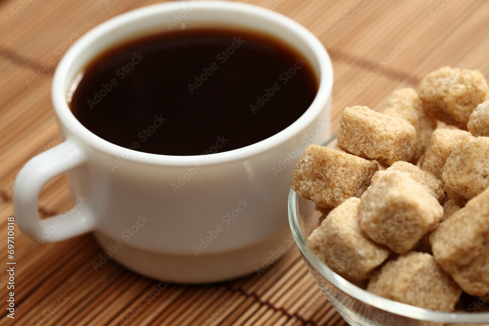 Coffee cup and brown cane sugar Coffee cup and brown cane sugar