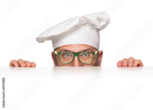Funny overweight chef peeking from behind the banner