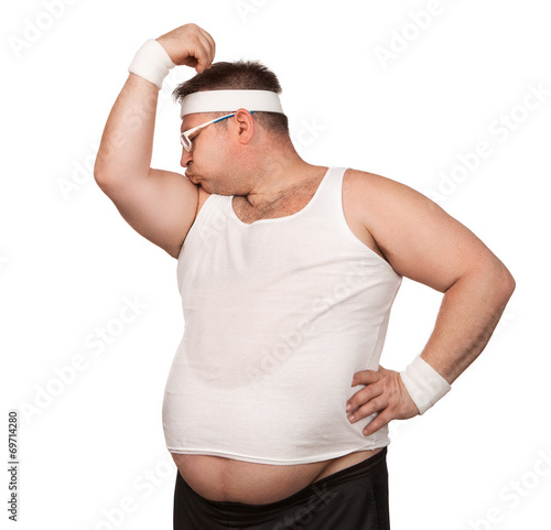 Funny overweight sport nerd kissing his bicep isolated on white photo