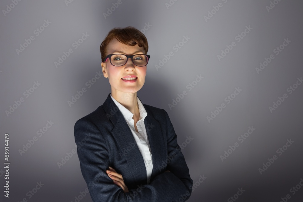 Businesswoman looking at camera with arms crossed