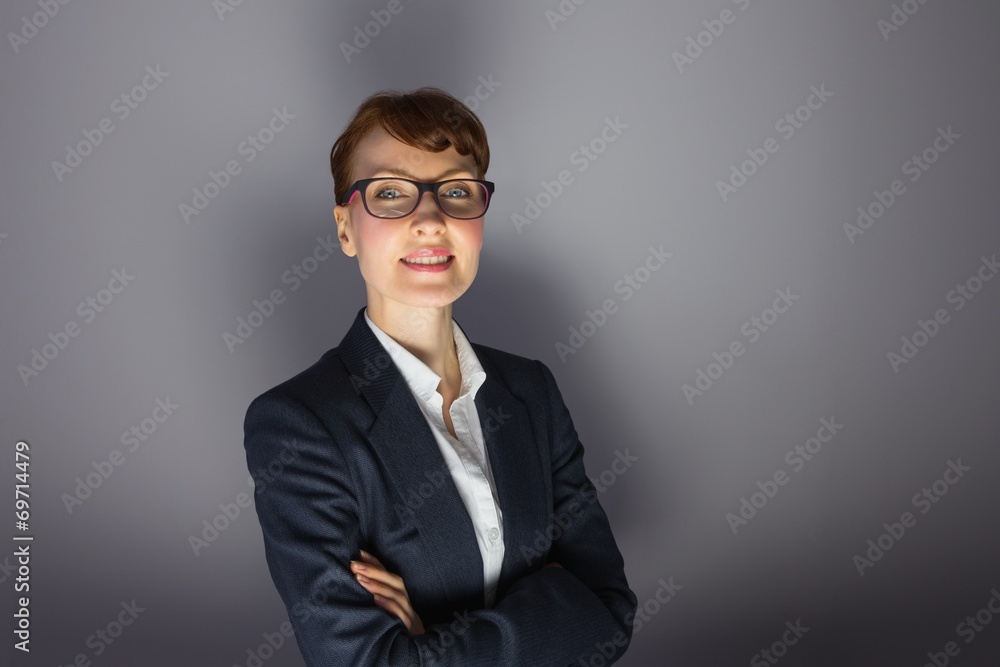 Businesswoman looking at camera with arms crossed Businesswoman looking at camera with arms crossed