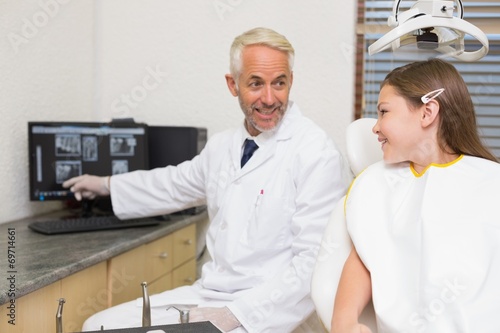 Dentist explaining xrays to little girl