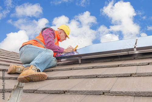 worker and solar panels