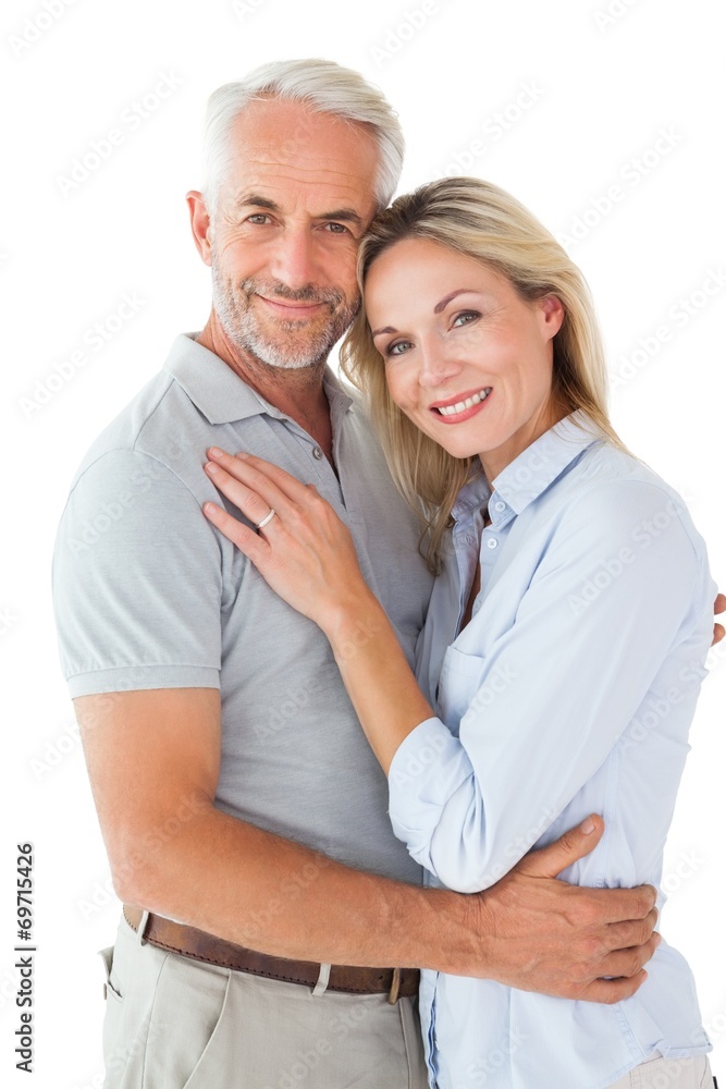 Happy couple standing and smiling at camera Happy couple standing and smiling at camera