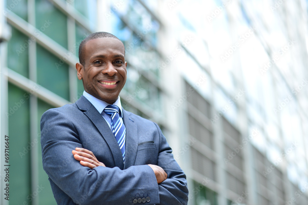 Handsome businessman with crossed arms Handsome businessman with crossed arms
