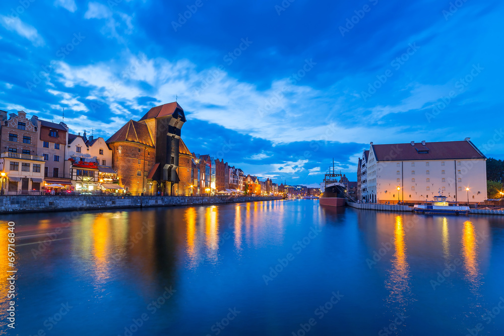 Naklejka premium Gdansk at night with reflection in Motlawa river, Poland