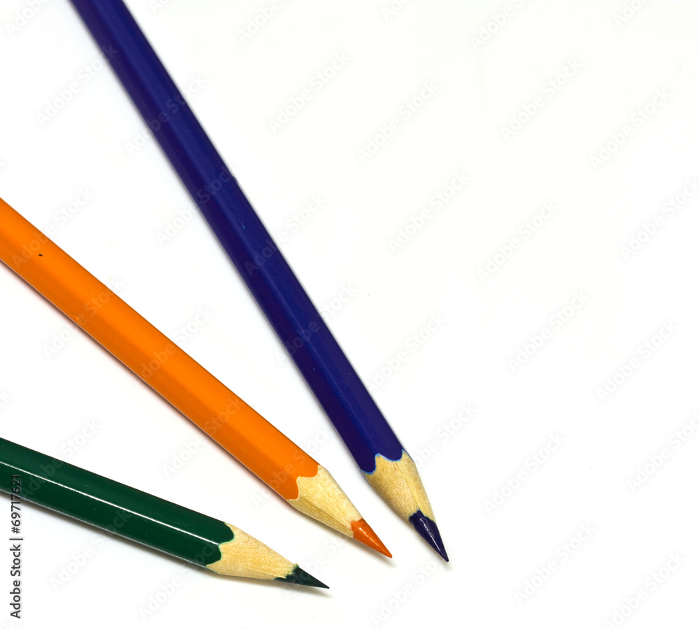 Colour pencils on white background close up Colour pencils on white background close up