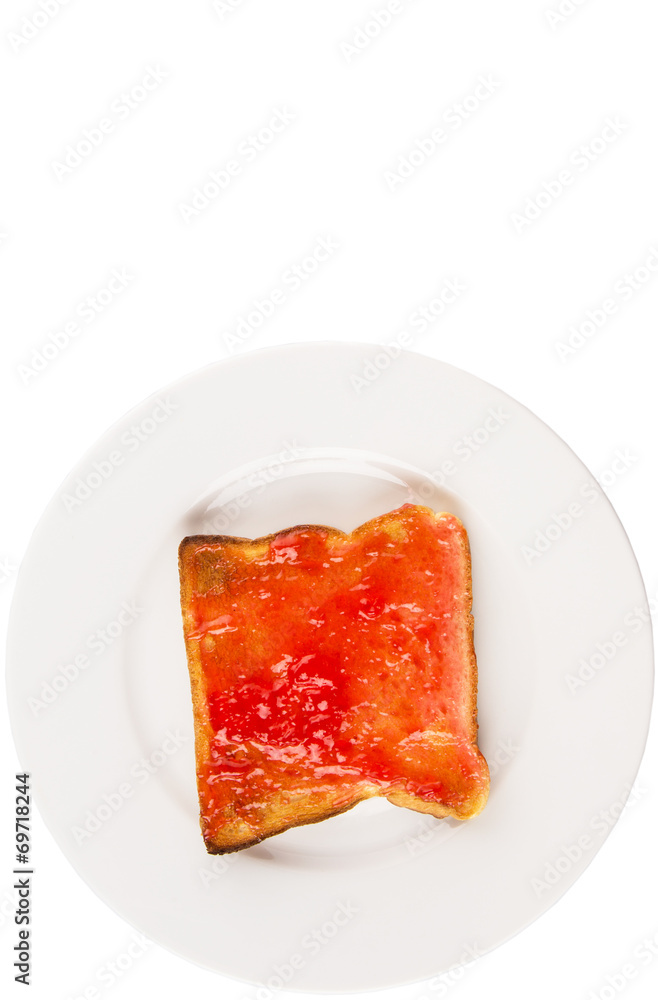 Bread toast with strawberry jam on white plate Bread toast with strawberry jam on white plate