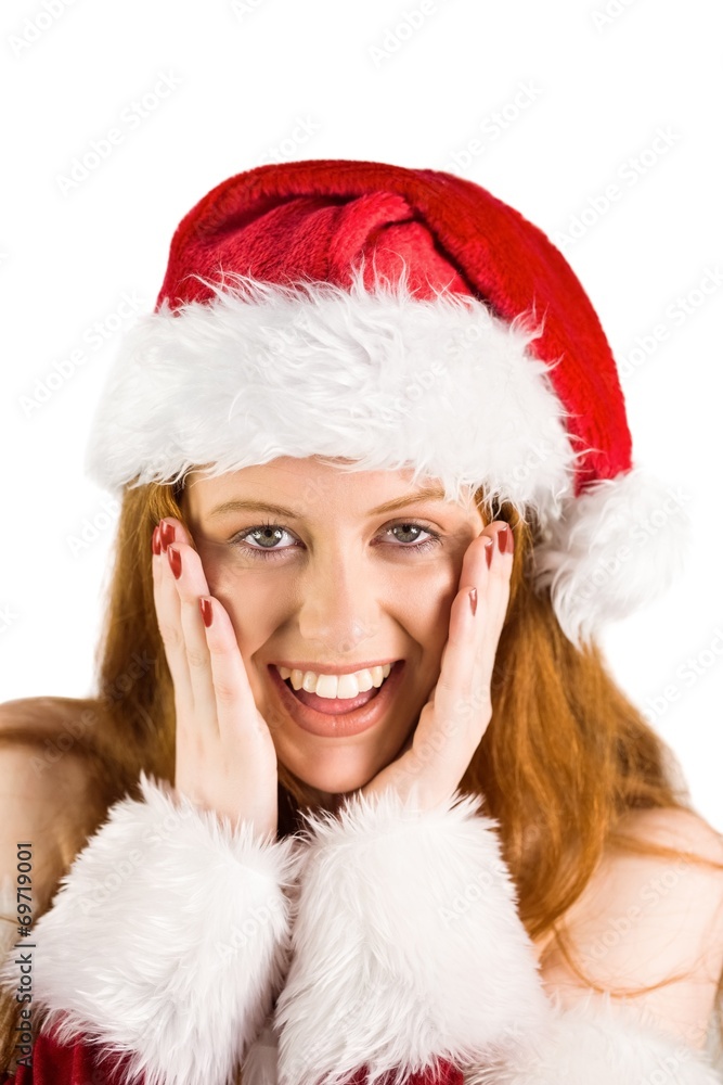 Festive redhead with hands on face Festive redhead with hands on face