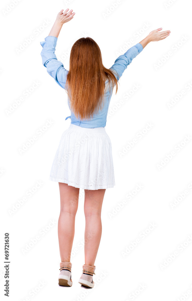 Back view of joyful woman celebrating victory hands up. Back view of joyful woman celebrating victory hands up.