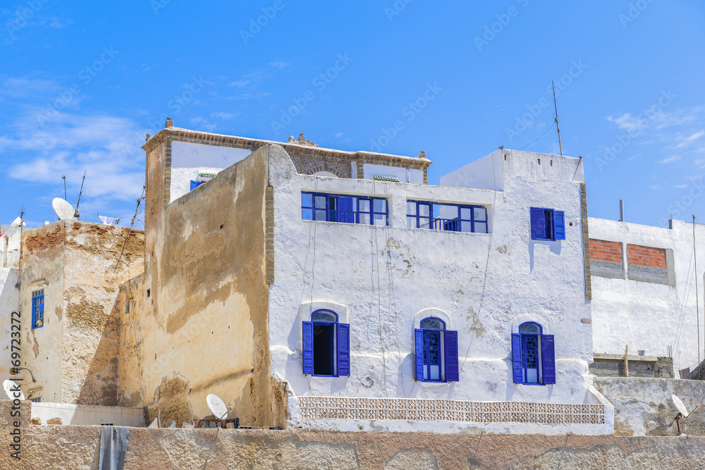 Old style building with white walls and blue windows