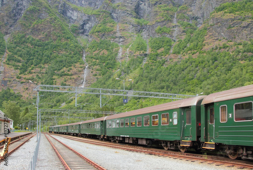 Tracks and passenger train. Flom, Norway