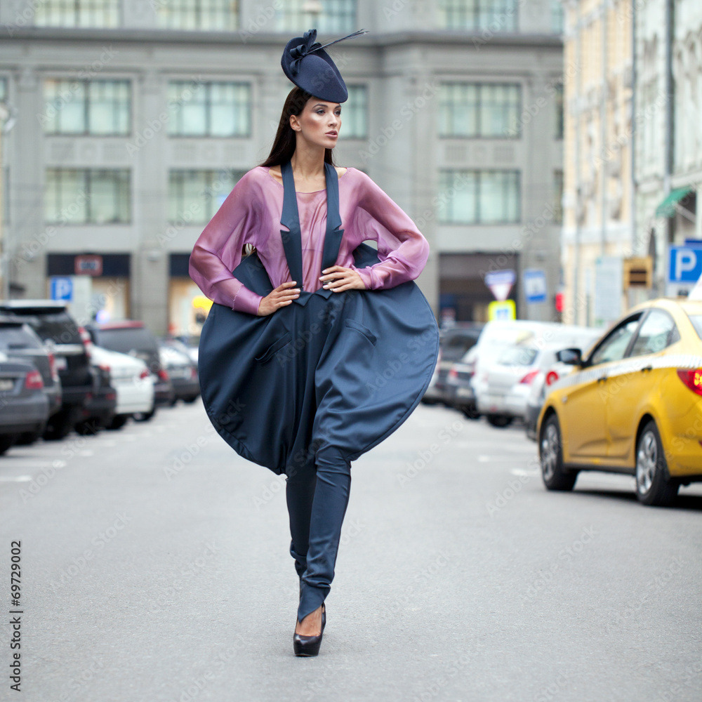 Fototapeta premium Young beautiful model in a stylish designer clothes
