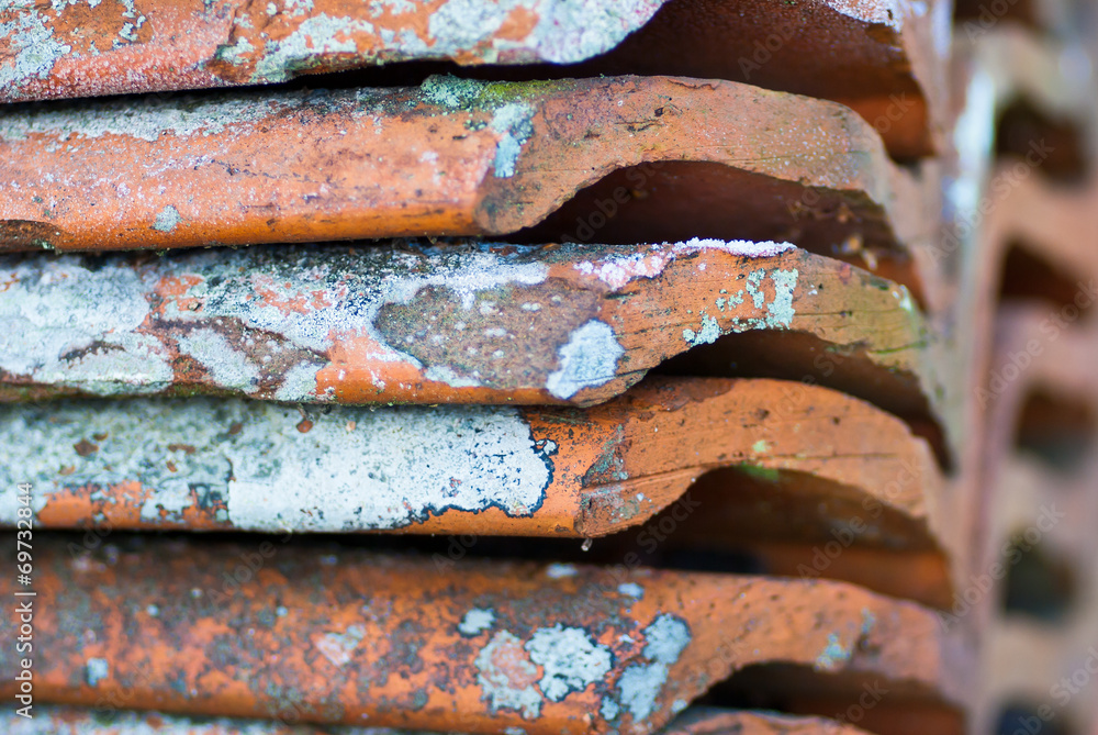 Stack of old roofing tiles with nice pattern.