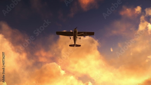 Small airplane plane flying in the dusk or dawn