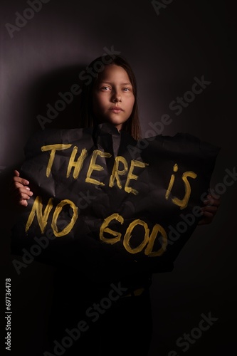 Atheist teen girl holding a banner with the inscription