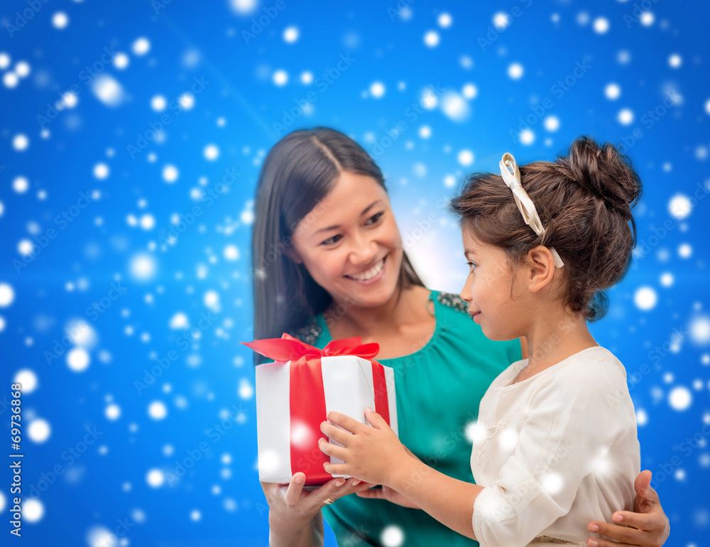 happy mother and child girl with gift box happy mother and child girl with gift box