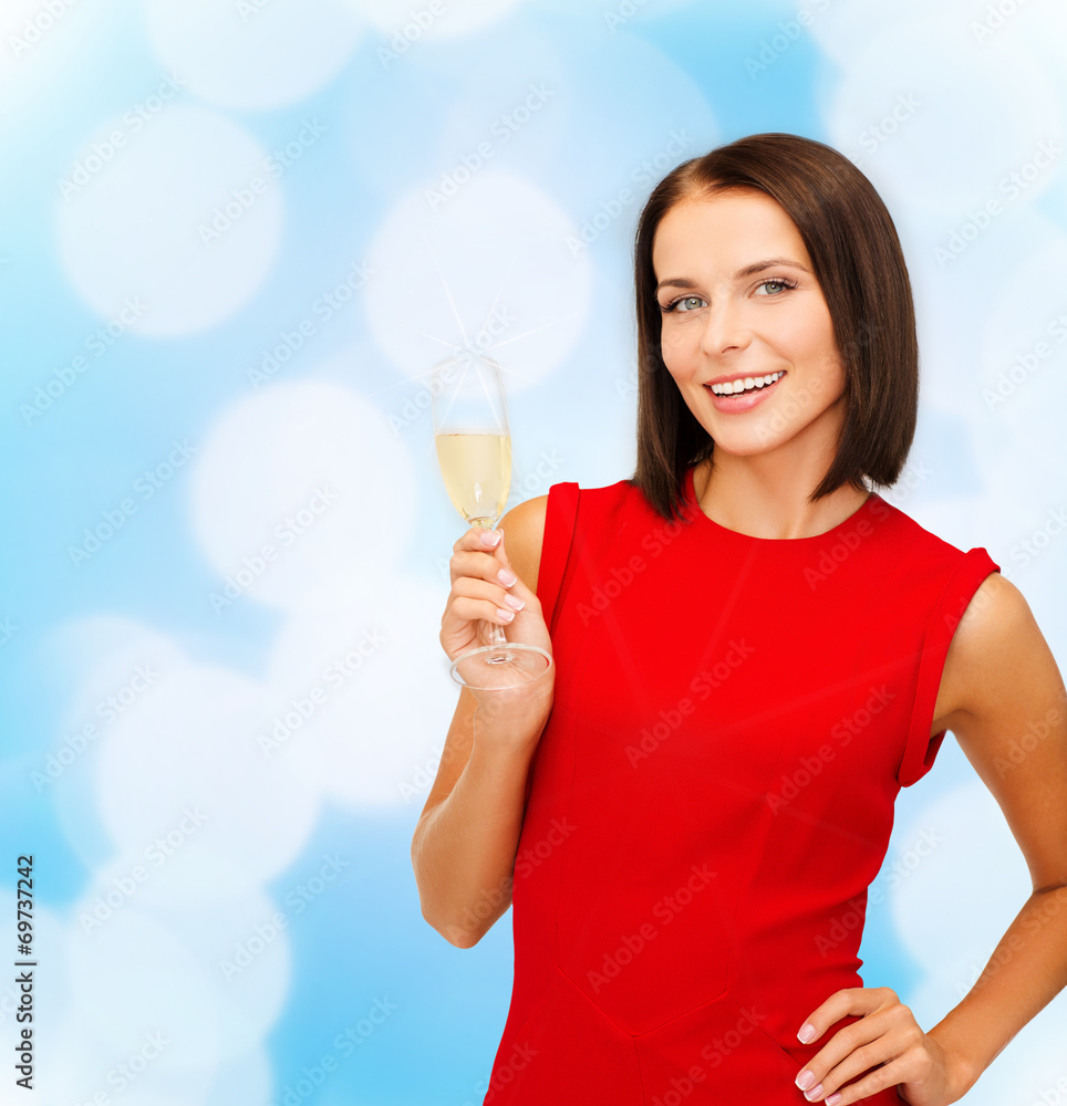 smiling woman holding glass of sparkling wine smiling woman holding glass of sparkling wine