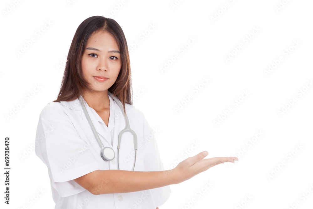 Asian young female doctor present something on her left Asian young female doctor present something on her left
