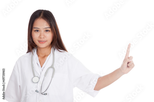 Asian young female doctor point to blank space