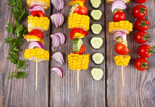 Sliced vegetables on picks on table close-up