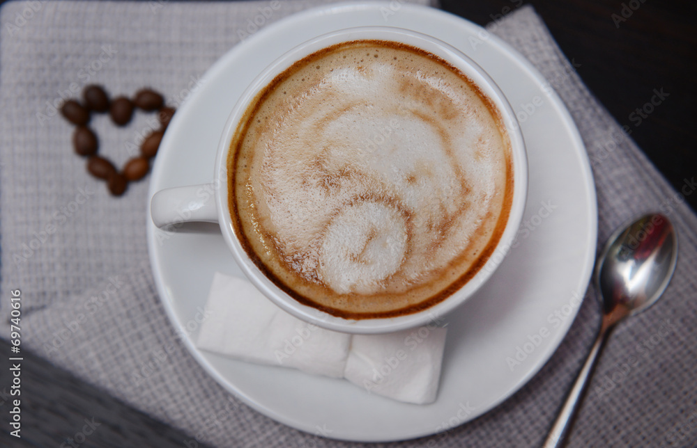 Cup of coffee with cute drawing in cafe Cup of coffee with cute drawing in cafe