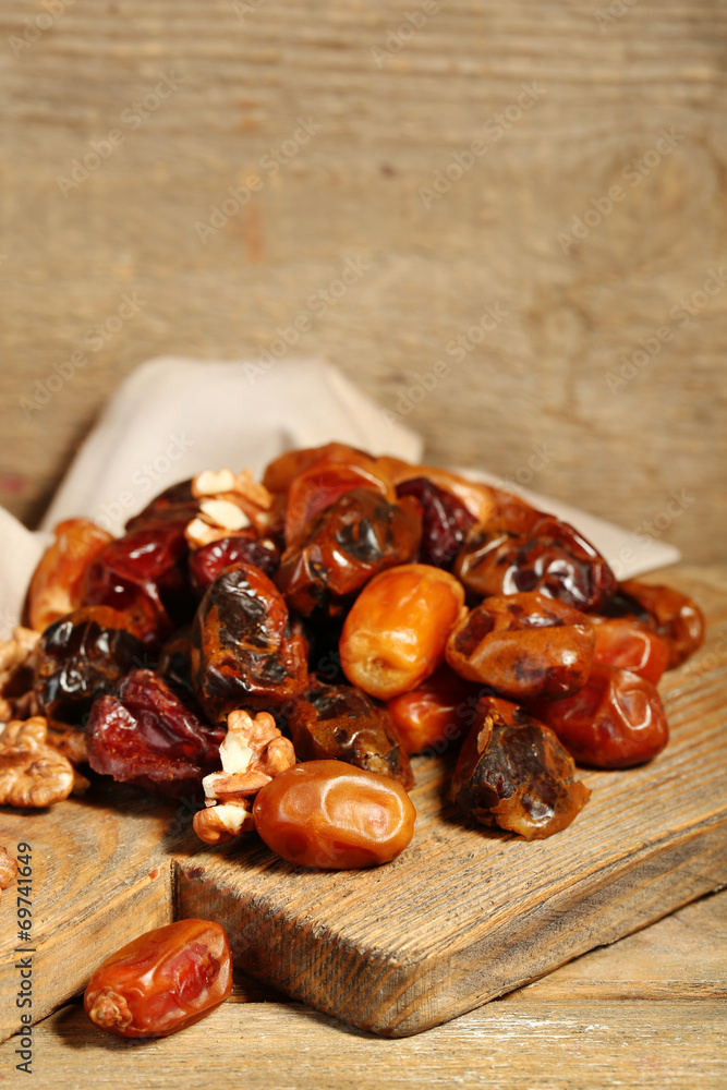 Tasty dates fruits on wooden table Tasty dates fruits on wooden table
