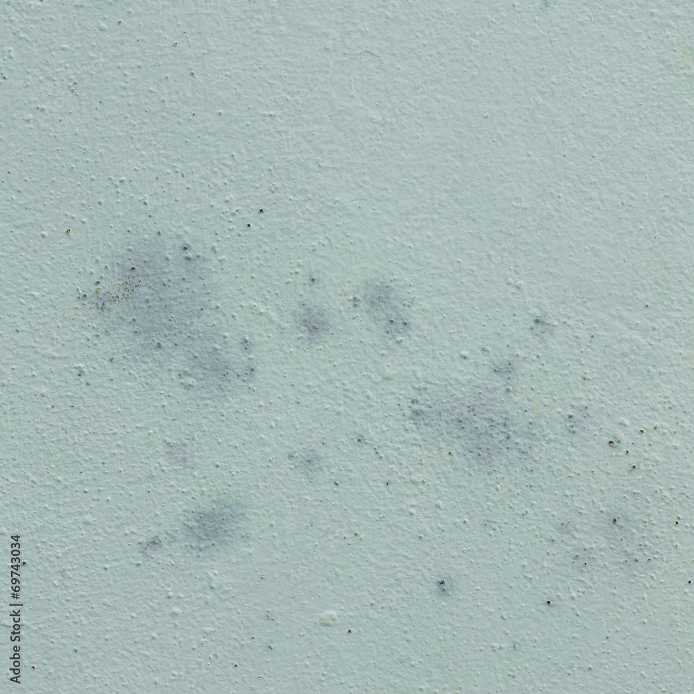 Obraz premium Rough textured blue wall with stains