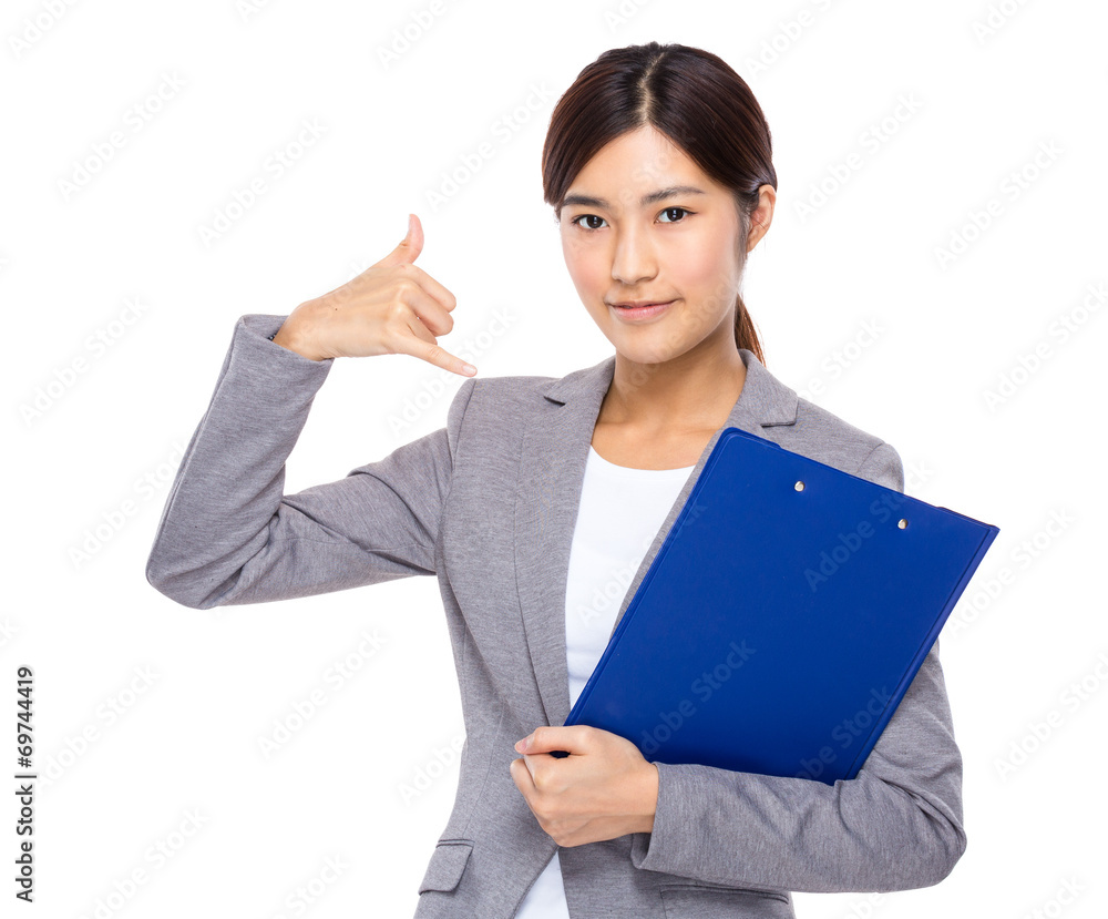 Businesswoman with clipboard and call me sign Businesswoman with clipboard and call me sign
