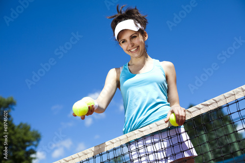 Young woman tennis player on the court  © Sebastian Duda