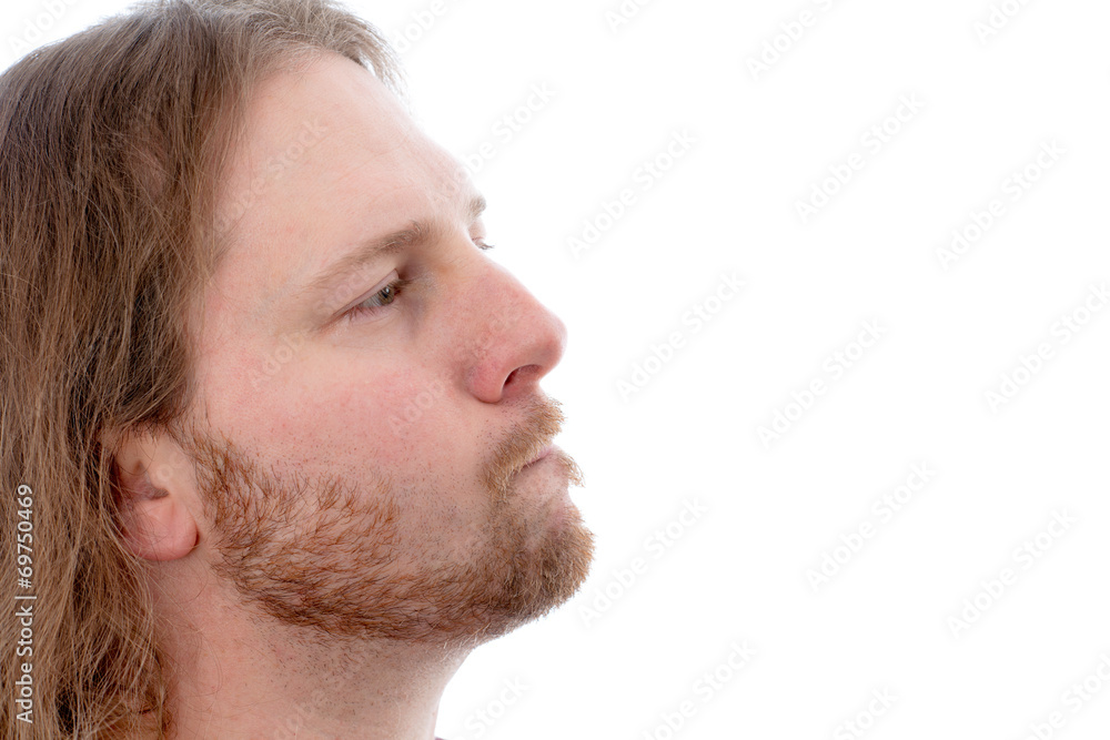Fototapeta premium long haired man i profile is looking scaptical