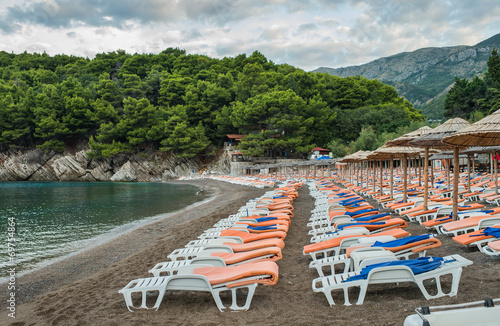 beach with deckchairs