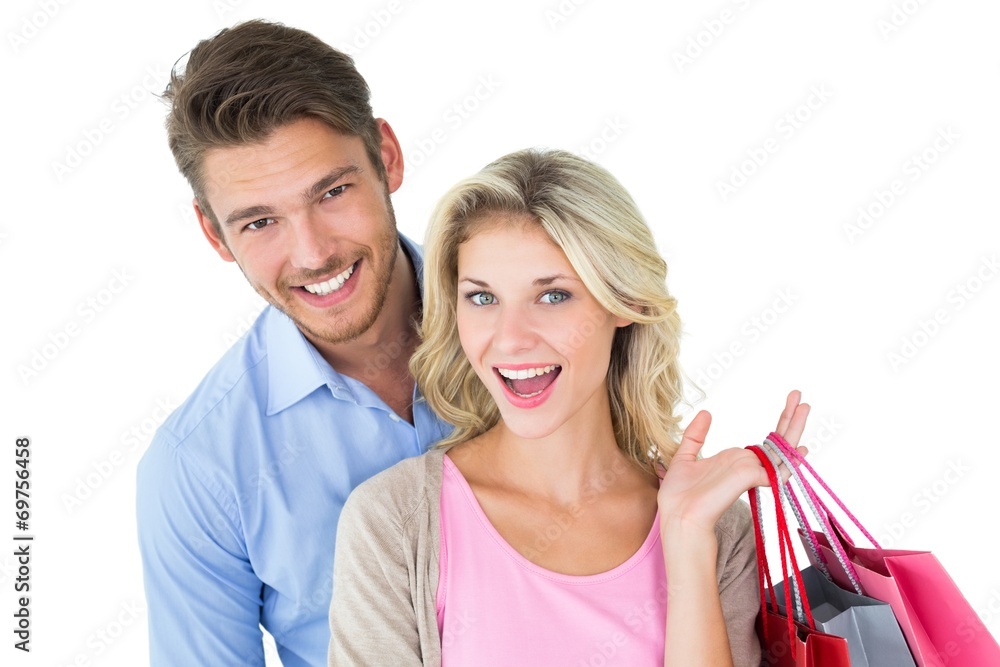 Attractive young couple holding shopping bags Attractive young couple holding shopping bags