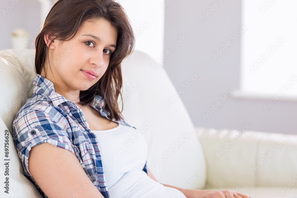 Pretty brunette relaxing on the couch Pretty brunette relaxing on the couch