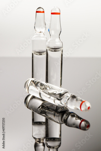 Clear medical ampules isolated on black background
