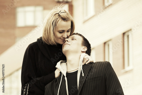 Happy young couple in love on the city street