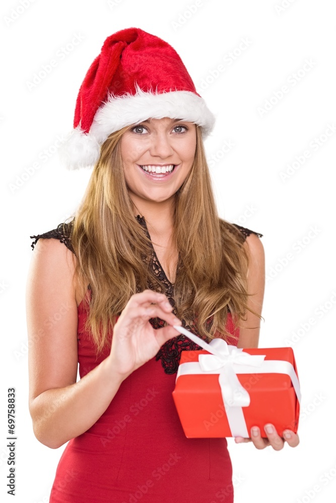 Festive blonde opening a gift Festive blonde opening a gift