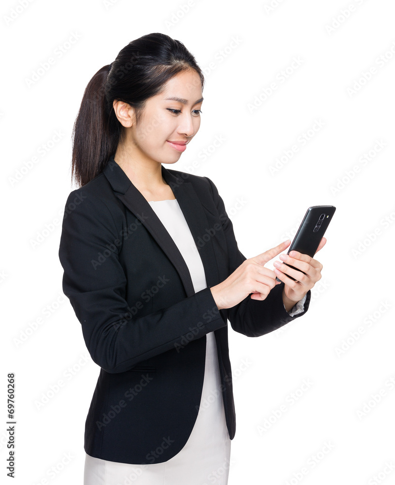 Businesswoman send message on cellphone Businesswoman send message on cellphone