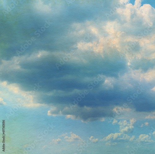 Sky with clouds in grunge textured style. Watercolor paper overl © Liliia