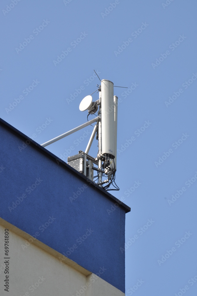Cellular communication aerial on a building roof Cellular communication aerial on a building roof