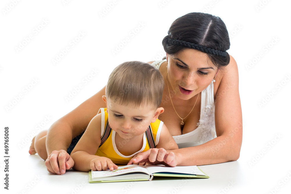 mother reading a book to her kid boy mother reading a book to her kid boy