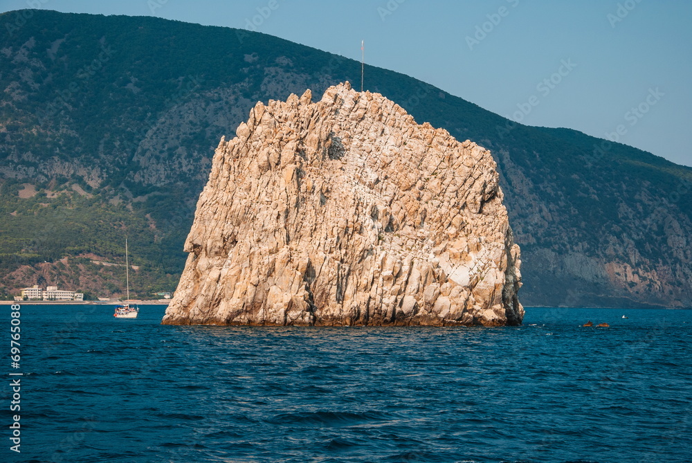 Black Sea landscape with rock and yacht