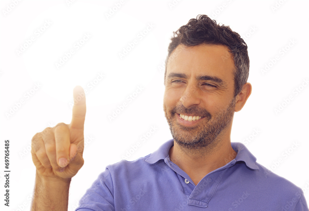 Handsome smiling man activating a touch screen Handsome smiling man activating a touch screen
