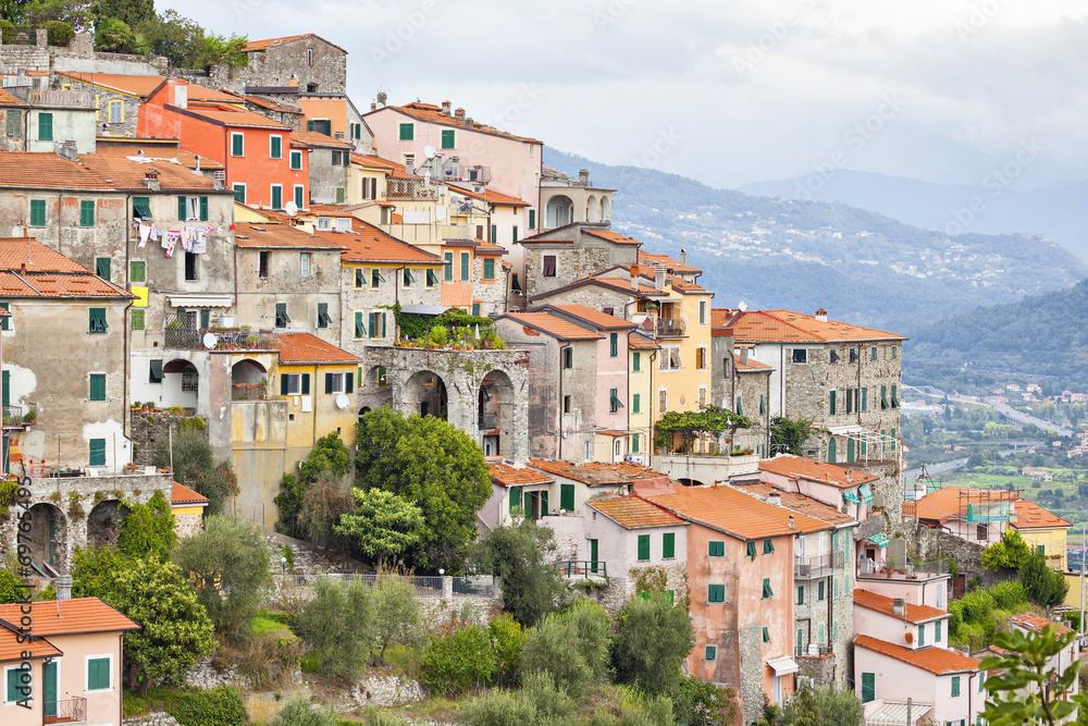 Small houses chaotically standing on the hill in Italy
